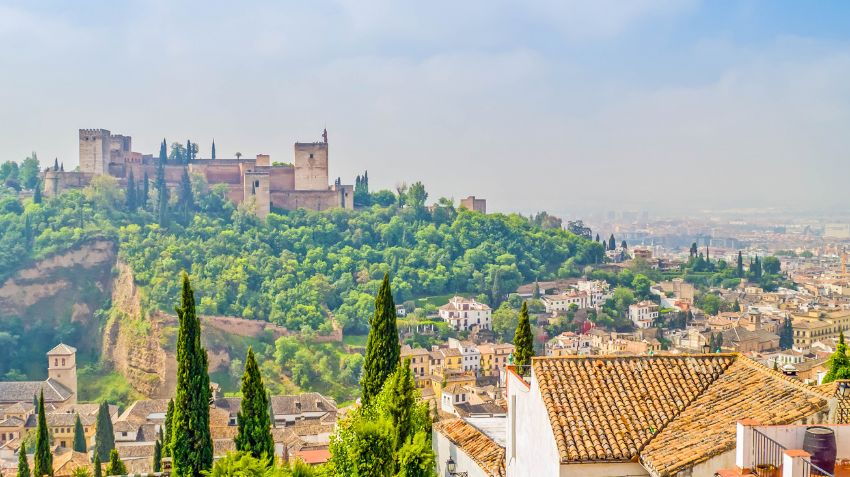 Is Granada worth visiting as a first-time traveler to Spain